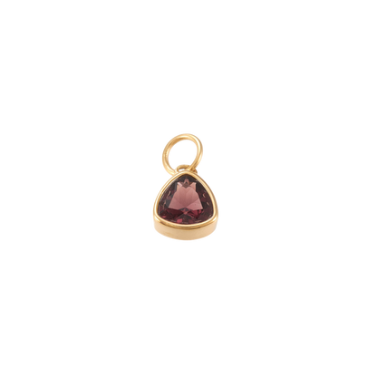 Gold triangular charm featuring a faceted deep burgundy gemstone on a transparent background.