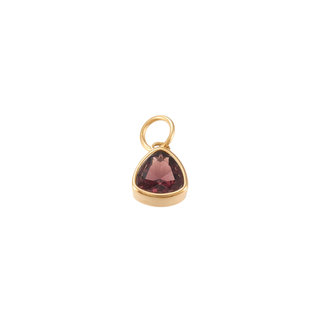 Gold triangular charm featuring a faceted deep burgundy gemstone on a white background.