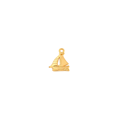 Gold nautical sailboat charm on white background