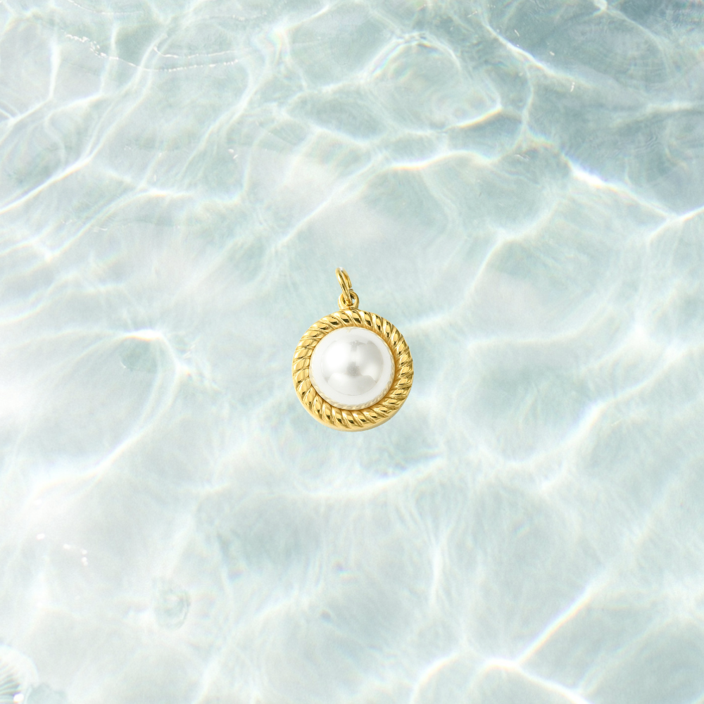 Gold pearl rope charm on a waterproof background
