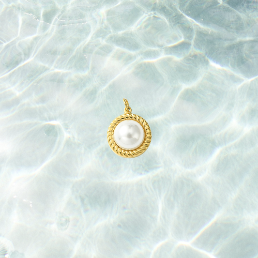Gold pearl rope charm on a waterproof background