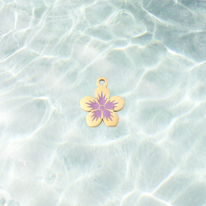 Gold purple flower charm on waterproof background