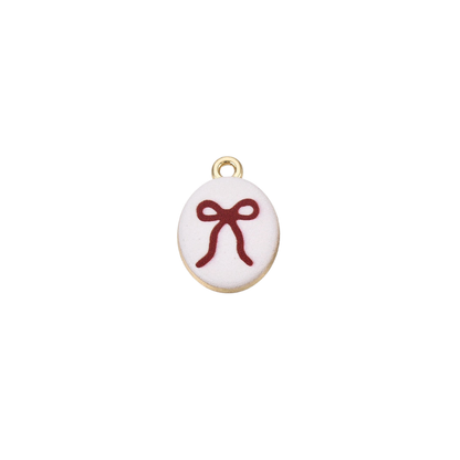 Gold oval charm featuring a red bow illustration on a white background