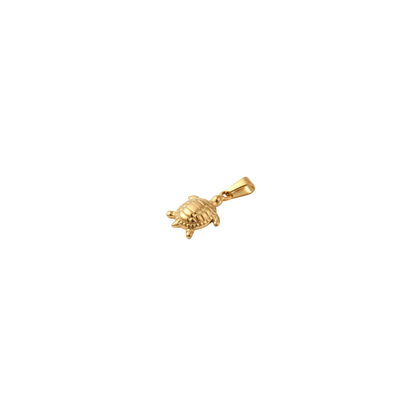 Close-up of a gold sea turtle charm with a textured shell and polished finish on a white background.