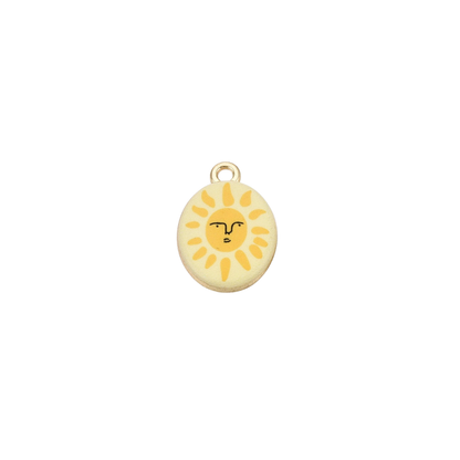 Gold oval charm featuring a smiling sun illustration with yellow rays on a cream background