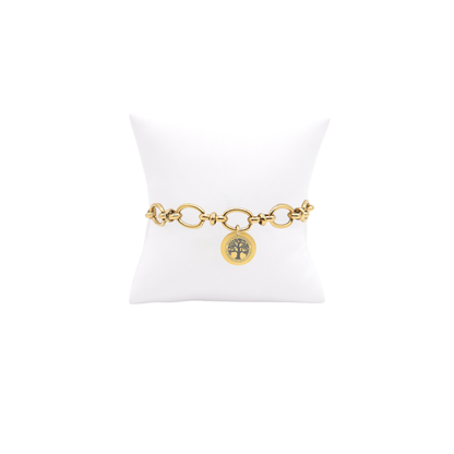 High Point University gold large link Evermore bracelet with small round charm with high point university life skills tree on white pillow front view
