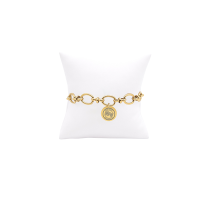 High Point University gold large link Evermore bracelet with small round charm with high point university text and hpu logo on white pillow front view
