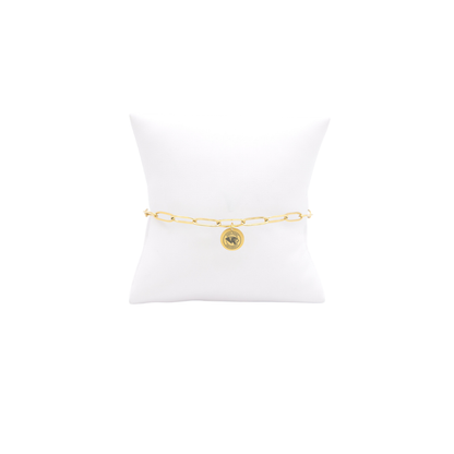 High Point University gold link storyline bracelet with small oval charm with high point university text and panther logo on white pillow front view
