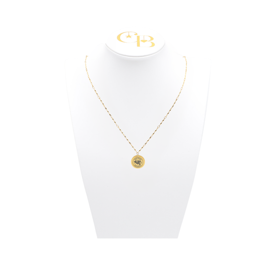 High Point University gold twist necklace with small round charm with high point university text and panther logo on white pillow front view
