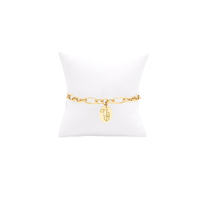 Pi Beta Phi gold large link keepsake bracelet with small oval charm displayed on white pillow front view with new vertical/stacked greek letters