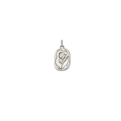 Silver embossed vintage rose charm featuring a raised floral design on an organic rectangular pendant, displayed on a transparent background.