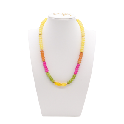 The Cactus Bloom Beaded Necklace featuring yellow, orange, hot pink, and green beads with polished gold-tone spacer accents.