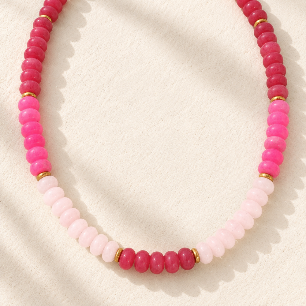 Canyon Rose Beaded Necklace featuring blush pink, fuchsia, and deep rose beads with polished gold-tone spacer accents.