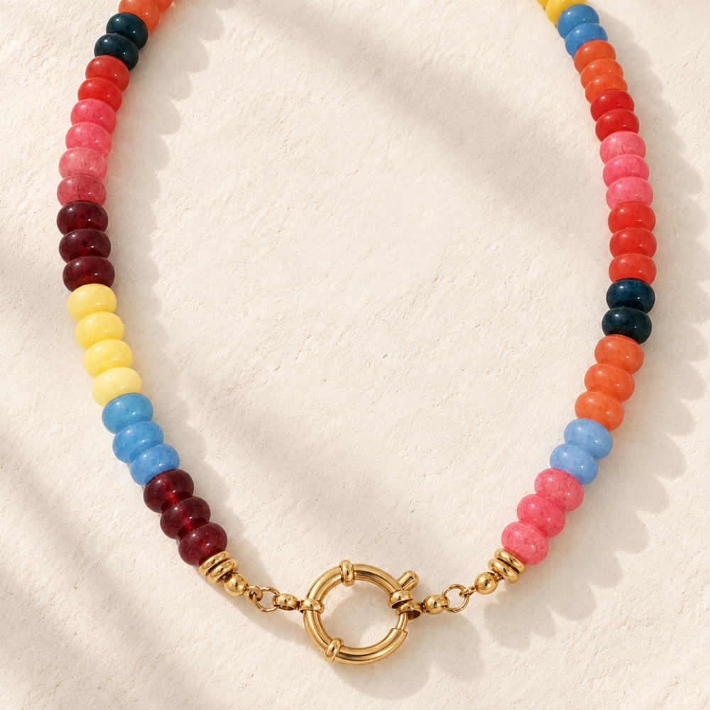 Sedona Sunset Beaded Necklace with multicolor red, pink, orange, yellow, blue and deep teal beads, finished with gold-tone accents and a front circular clasp.