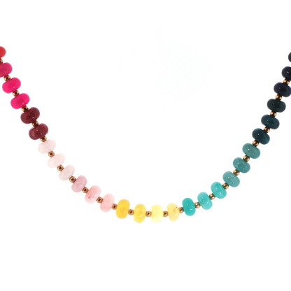 Wildflower Beaded Necklace featuring multicolor turquoise, blue, pink, red, yellow, cream, and brown beads with subtle gold-tone spacer accents.