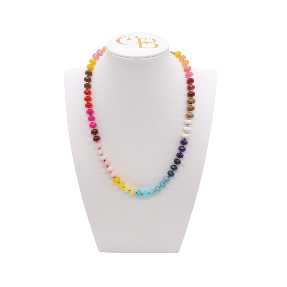 Wildflower Beaded Necklace featuring multicolor turquoise, blue, pink, red, yellow, cream, and brown beads with subtle gold-tone spacer accents.