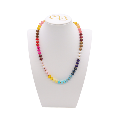 Wildflower Beaded Necklace featuring multicolor turquoise, blue, pink, red, yellow, cream, and brown beads with subtle gold-tone spacer accents.