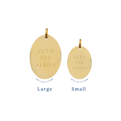 Zeta Tau Alpha gold large oval charm and small oval charm comparison with full sorority name front view.

