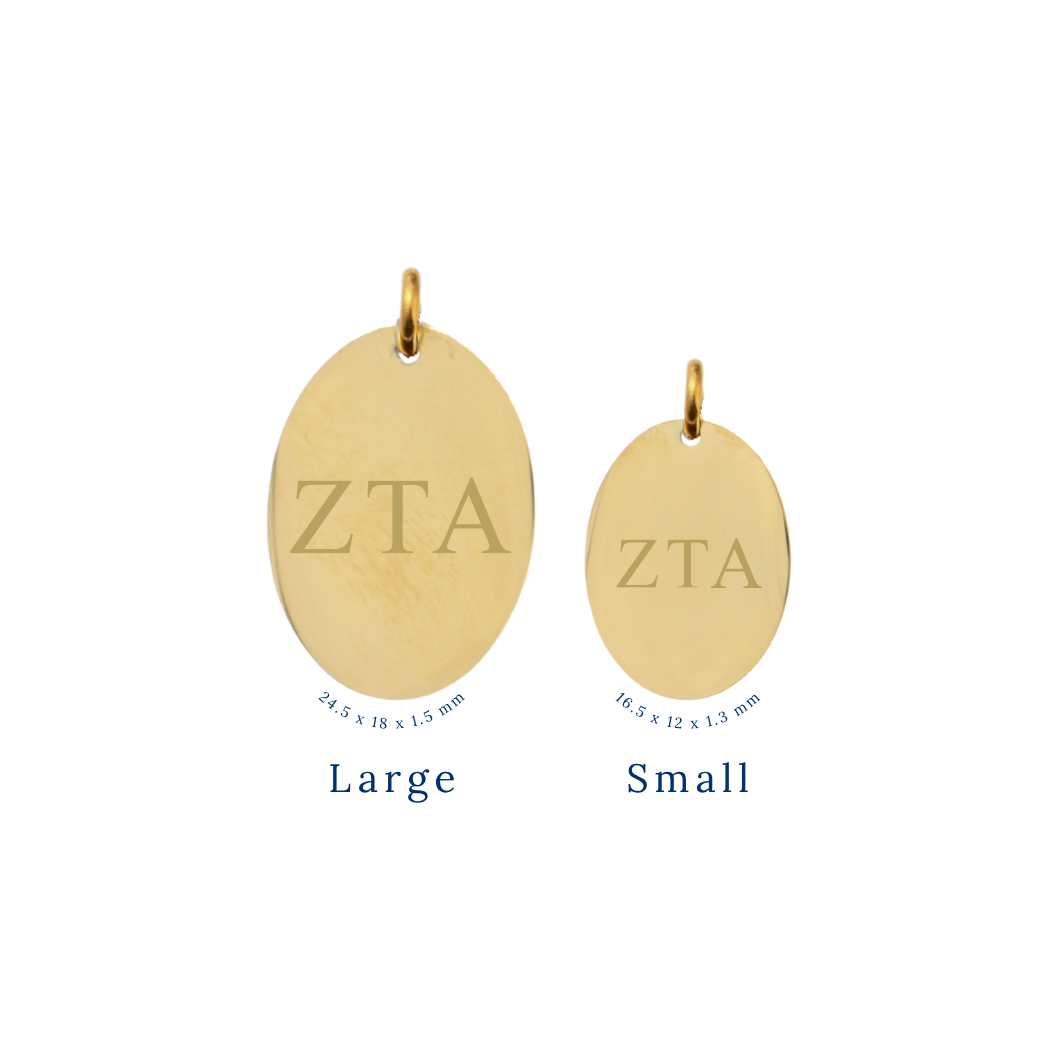 Zeta Tau Alpha gold large oval charm and small oval charm comparison with horizontal greek letters front view.