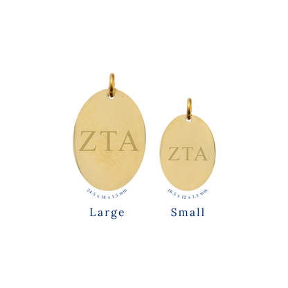Zeta Tau Alpha gold large oval charm and small oval charm comparison with horizontal greek letters front view.