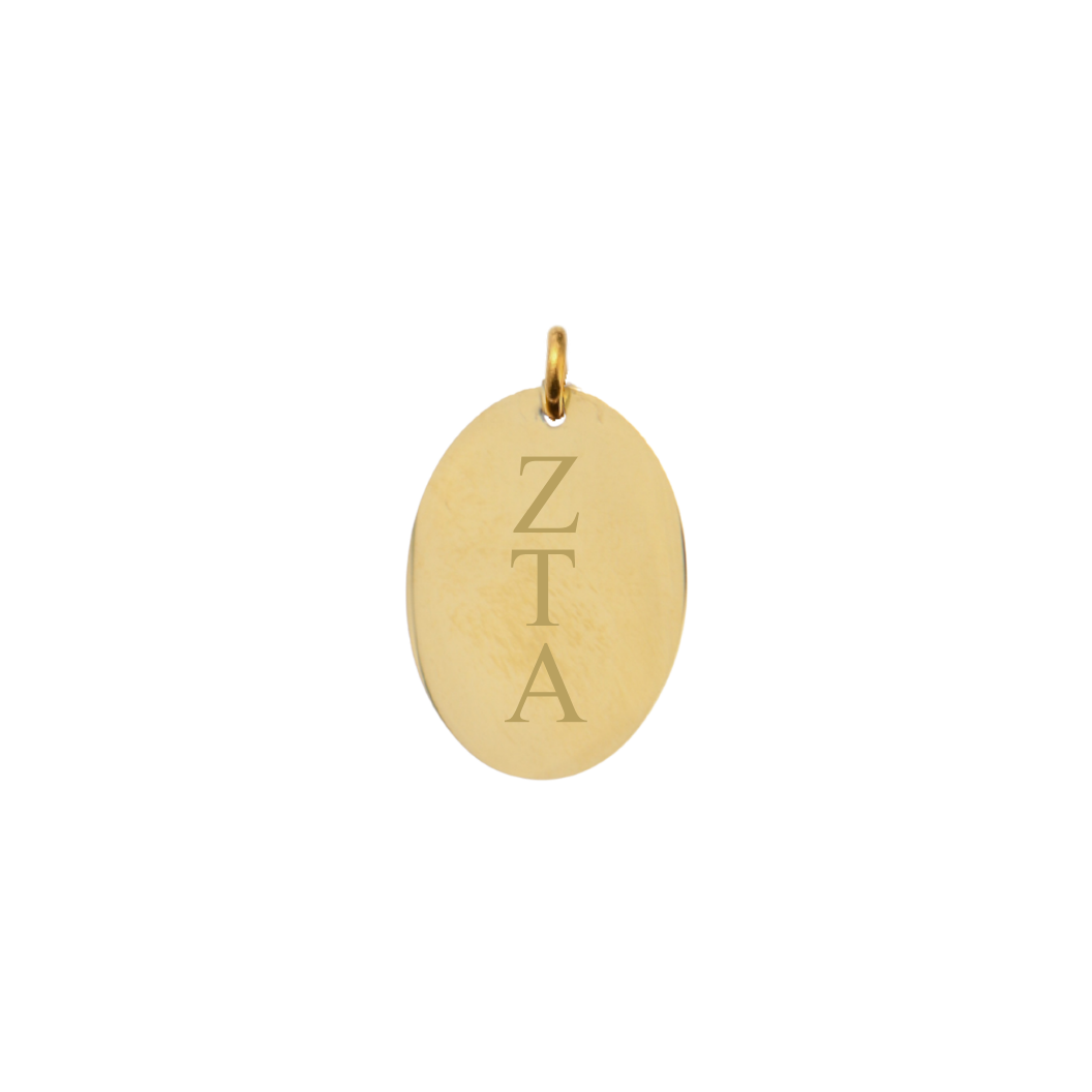 Zeta Tau Alpha gold large oval charm with vertical greek letters front view,.