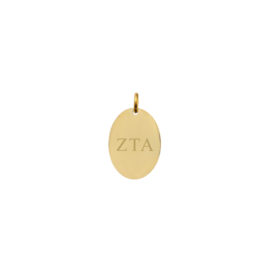 Zeta Tau Alpha gold small oval charm with horizontal greek letters front view.